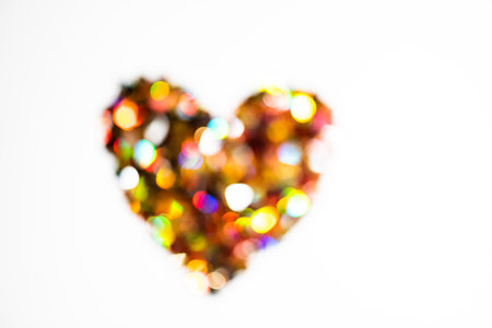 Colorful heart shape bokeh on white background. love concept.の写真素材