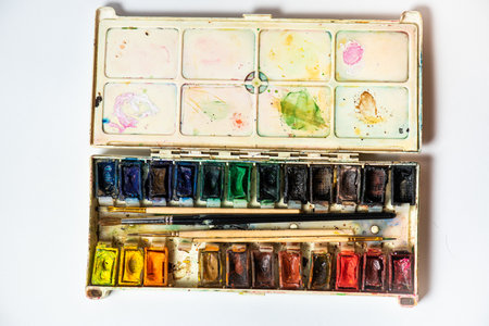 Watercolor paints in a box on a white backgroundの写真素材