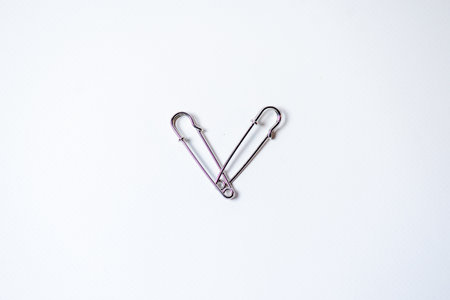 Safety pin isolated on white background with copy space for your text.の写真素材