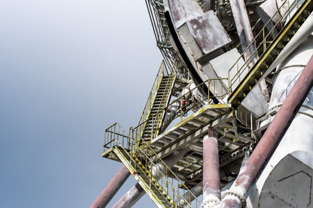 Tower of a large oil and gas refinery. Industrial equipment.