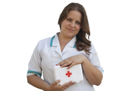 Young nurse holding a first aid kitの写真素材