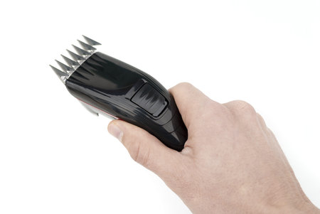 Hand with hair clippers