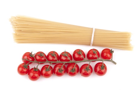 Red cherry tomatoes and noodles の写真素材
