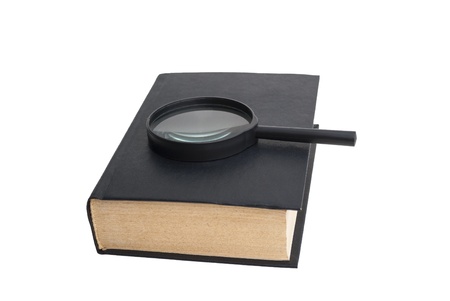 Book and magnifying glass on white backgroundの写真素材