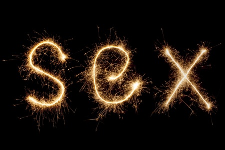 The word "Seh" in sparklers on black backgroundの写真素材