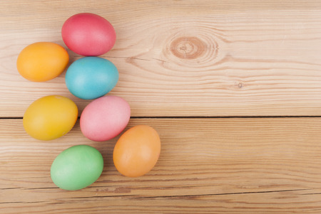 Easter eggs on wooden background.の写真素材