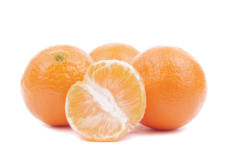 Fresh ripe tangerines on a white background.の写真素材
