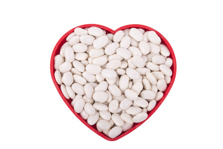 Plate with beans isolated on white background.の写真素材