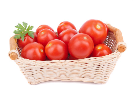 Red tomatoes in a basket.の写真素材