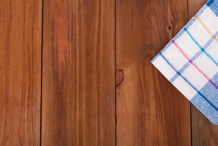 Kitchen napkin on a wooden table.