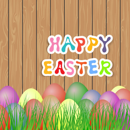 Easter eggs in the grass on a wooden background.のイラスト素材