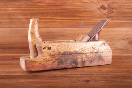 Old jointer on a wooden background.の写真素材