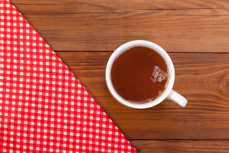 Tea table cloth on a wooden table.の写真素材