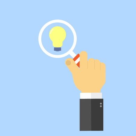 Hand with magnifying glass and light. The concept of innovation. Vector illustration .のイラスト素材