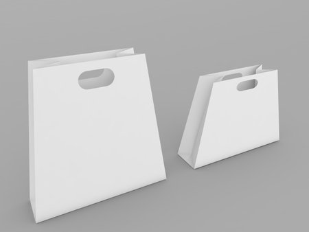 Two paper shopping bag mockups on a gray background. 3d render illustration.の写真素材
