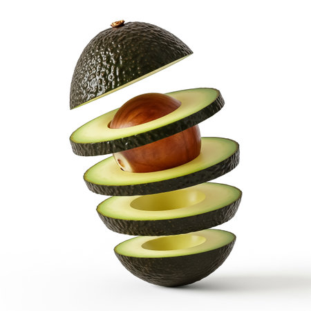An avocado is expertly sliced into even sections, revealing its vibrant inner flesh and a central pit, demonstrating creative fruit display techniques.の素材