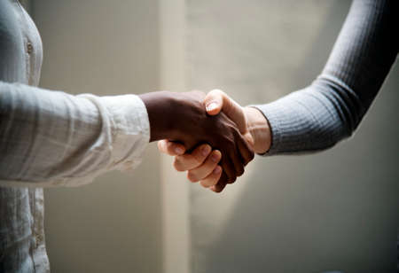 Two business people shaking handsの写真素材