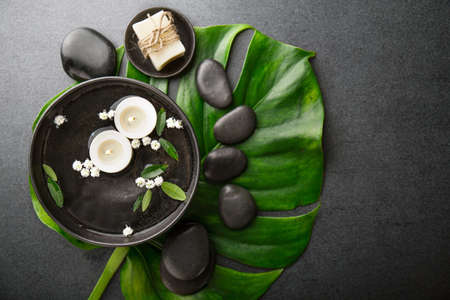 Spa Wellness Relax concept. Spa background with spa accessories on dark background. View from above with copy space.の写真素材