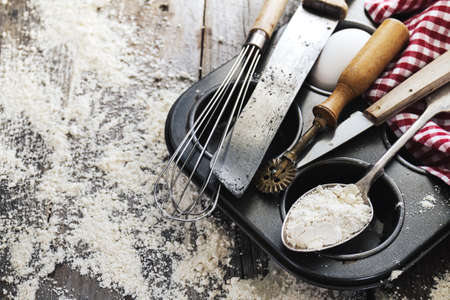 Baking concept kitchen cooking cutlery accessories for baking on wooden background with flour. Top View. Cooking Process. Nobody.の写真素材