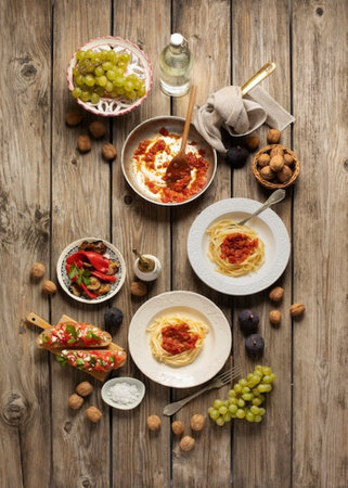 Pasta with bolognese sauce on wooden background. Top viewの写真素材