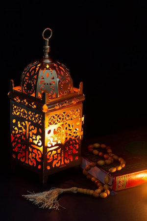Ramadan Kareem background. Arabic lantern on a black background.