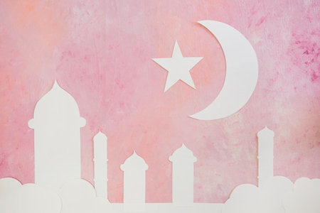 Ramadan Kareem background with mosque and crescent on pink wallの写真素材