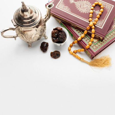 Holy Quran, rosary beads, rosary and dates on white backgroundの写真素材