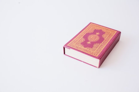 Bible on a white background. The book of the Quran.の写真素材