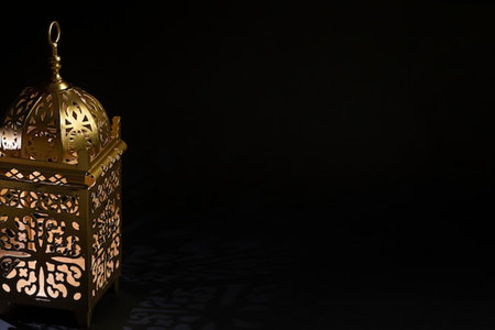 Arabic lantern on black background. Ramadan Kareem greeting card.