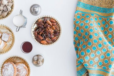 Top view of dates and milk on white background, Ramadan Kareem concept