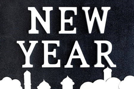 New Year's card. White lettering New Year on black background.の写真素材