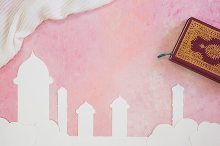 Quran, holy book of Muslims ( public item of all muslims ) on a pink background with copy spaceの写真素材