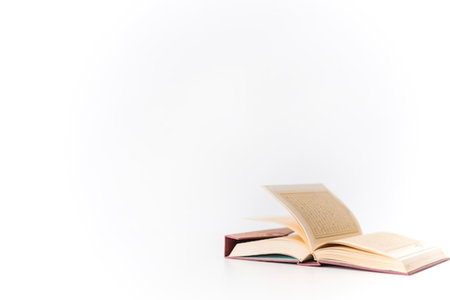 Opened book on white background with copy space for your text.
