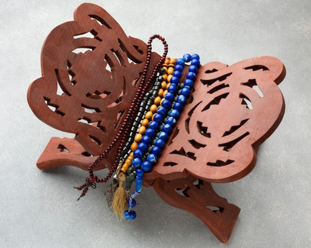 Wooden beads and pendants on a white background, close-up