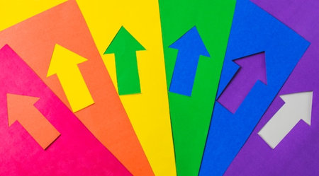 Colorful paper arrows on colorful background. Business and finance concept.の写真素材