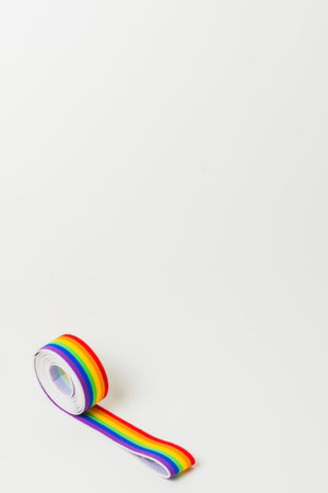 Roll of rainbow colored adhesive tape isolated on white background. Copy space.の写真素材