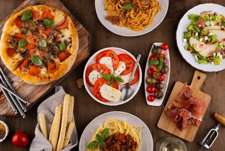 Top view of pizza ingredients on wooden table. Italian food background.の写真素材