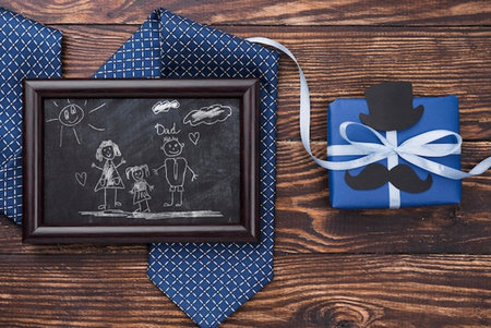 Fathers day concept with father and son drawing on chalkboard.の写真素材