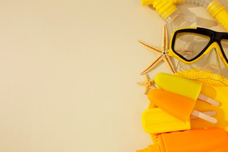 Summer background with sunglasses, seashells and ice cream on yellow background