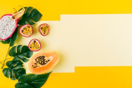 Exotic fruits on yellow background. Healthy food concept. Copy space.の写真素材
