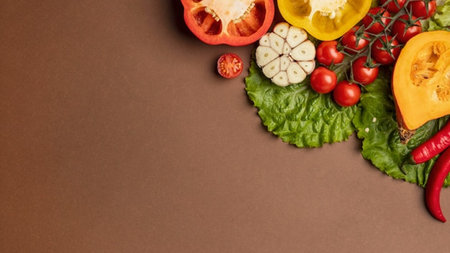 Fresh vegetables on a brown background. Top view with copy space.の写真素材