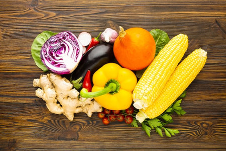Vegetables on a wooden background. Healthy food. Top view