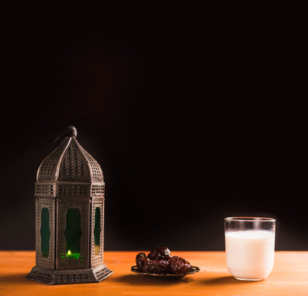 Ramadan Kareem greeting card with lantern, dates and glass of milkの写真素材