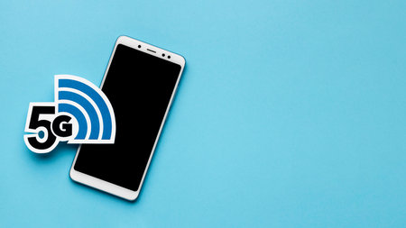 5G network icon with smartphone on blue background. 5G technology conceptの写真素材