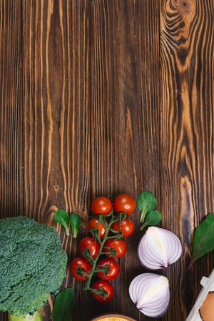 Fresh vegetables on a wooden background. Top view with copy space.