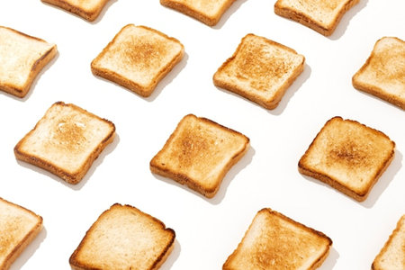 slices of toast bread on a white background. top viewの写真素材