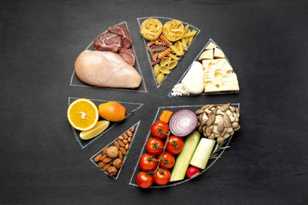Foods high in protein on a black background. Top view.