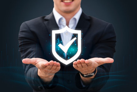 Businessman holding shield with check mark in his hand. Security conceptの写真素材