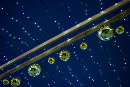 Hanging garland with Christmas balls over night sky background