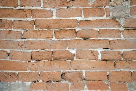 Closeup of an old red brick wall. Useful for backgroundsの写真素材